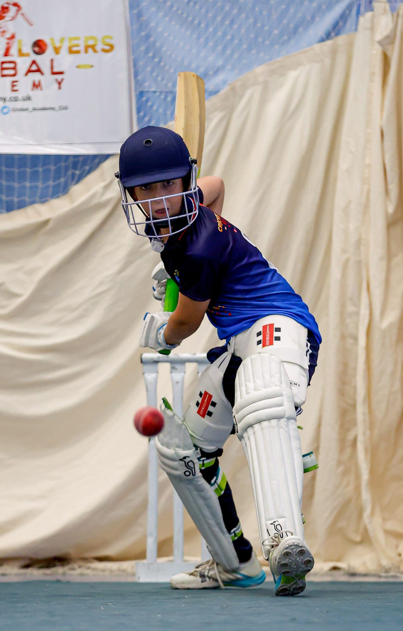 Player batting in academy nets